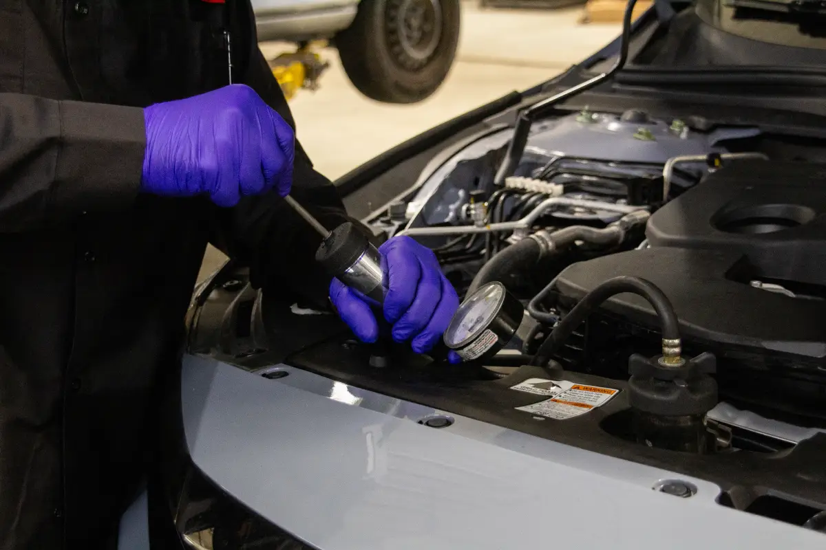 Oil change service being performed on a vehicle at WestWoodHonda