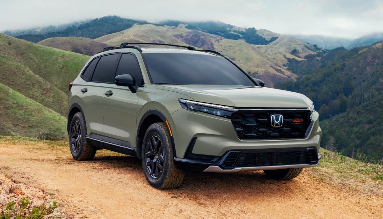 2026 Honda CR-V front three-quarter view parked on a dirt trail in hills
