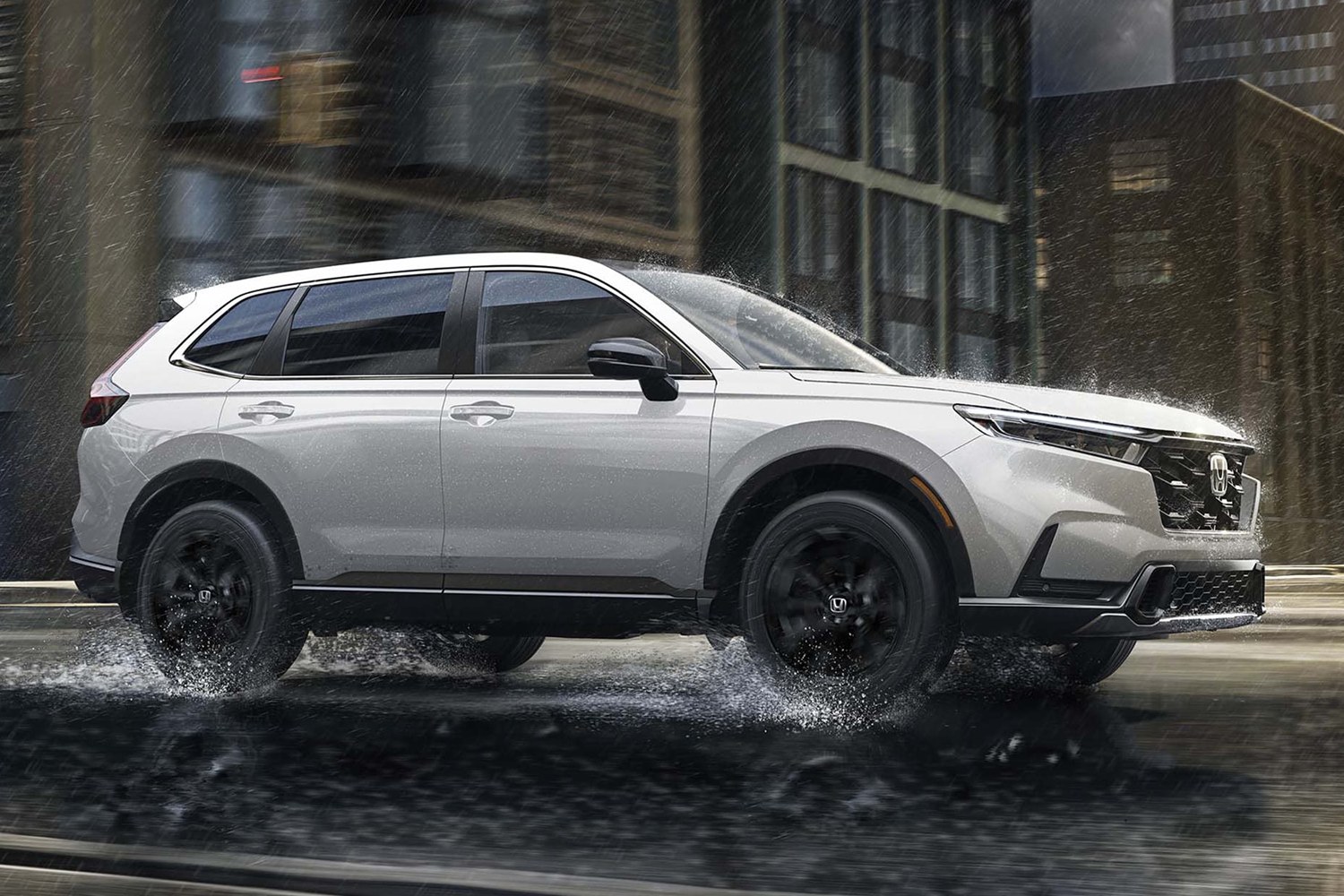 2027 Honda CR-V side view driving through rain on a city street